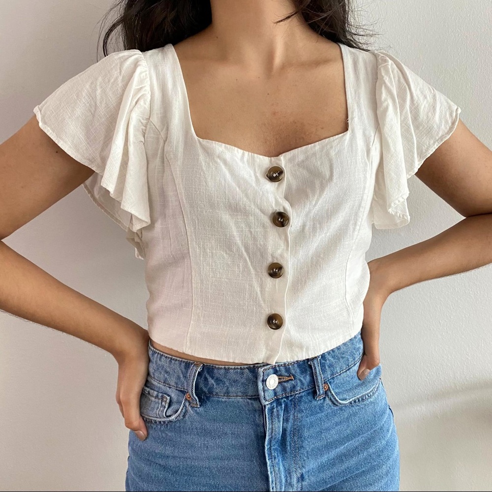 Buttoned-down Crop Top with flutter sleeves.